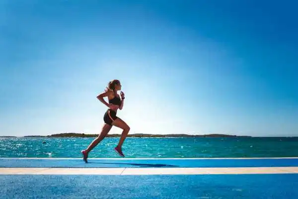 Woman running showing strong leg muscle Hereford
